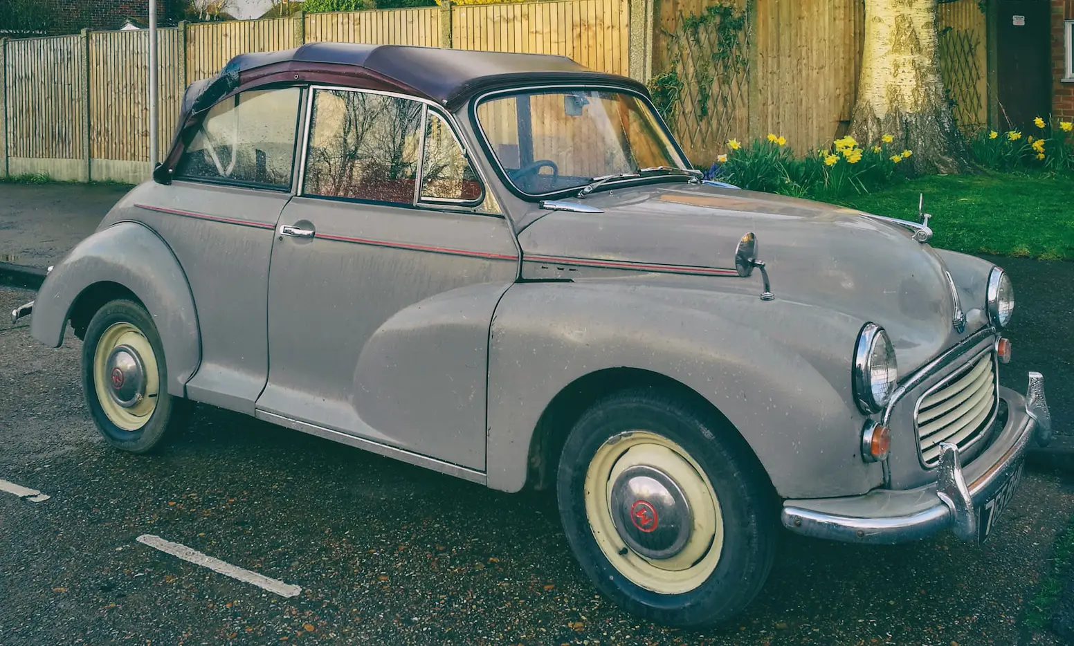 vintage morris car parked in a residential street